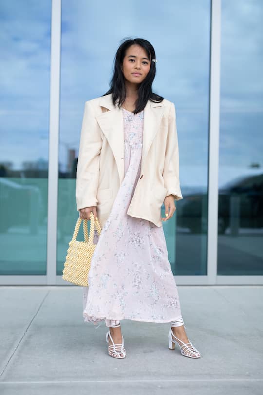 MIAMI, FL - DECEMBER 05: A guest is seen on the street attending Art Basel Private Day during Miami Art Week wearing cream blazer, pink dress, pearl bag and white shoes on December 5, 2018 in Miami, Florida. (Photo by Matthew Sperzel/Getty Images)
