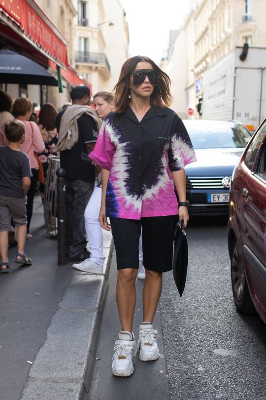 PARIS, FRANCE - JUNE 21: A guest is seen on the street during Men's Paris Fashion Week wearing pink/black tie dye skirt with white sneakers on June 21, 2019 in Paris, France. (Photo by Matthew Sperzel/Getty Images)