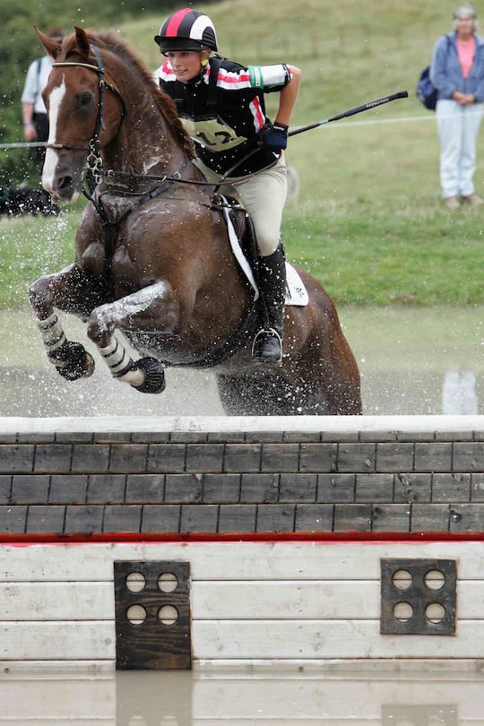 TETBURY, ENGLAND - AUGUST 5: Zara Phillips, on Ardfield Magic Star, competes in the cross country event on the second day of the Gatcombe Horse Trials at the Gatcombe Estate on August 5, 2006 in Tetbury, England. (Photo by Matt Cardy/Getty Images)