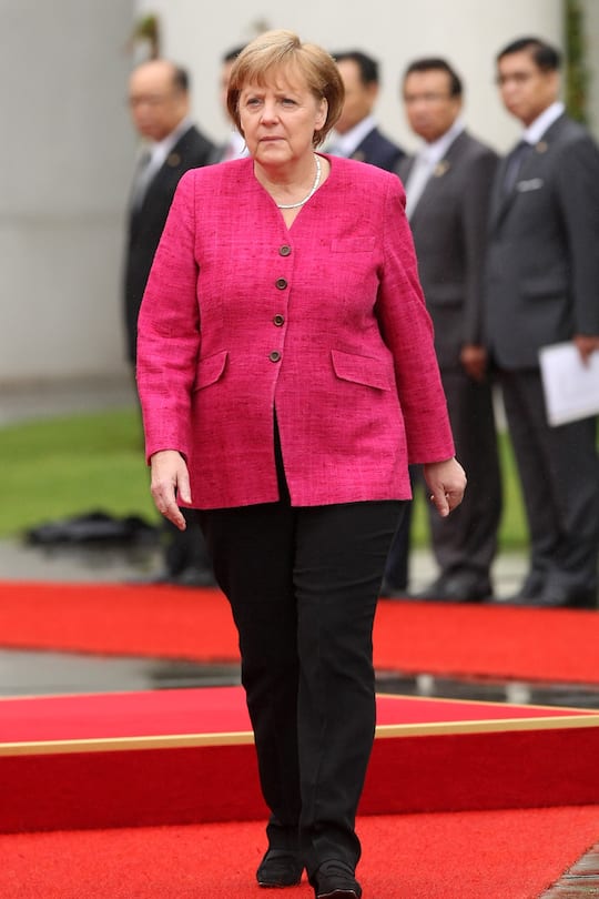 BERLIN, GERMANY - JULY 18: German Chancellor Angela Merkel attends a military ceremony upon the arrival of Thai Prime Minister Yingluck Shinawatra at the German federal chancellory on July 18, 2012 in Berlin, Germany. Yingluck, Thailand's first female prime minister, is on her first state visit outside of Asia since she took office in August of last year. (Photo by Adam Berry/Getty Images)