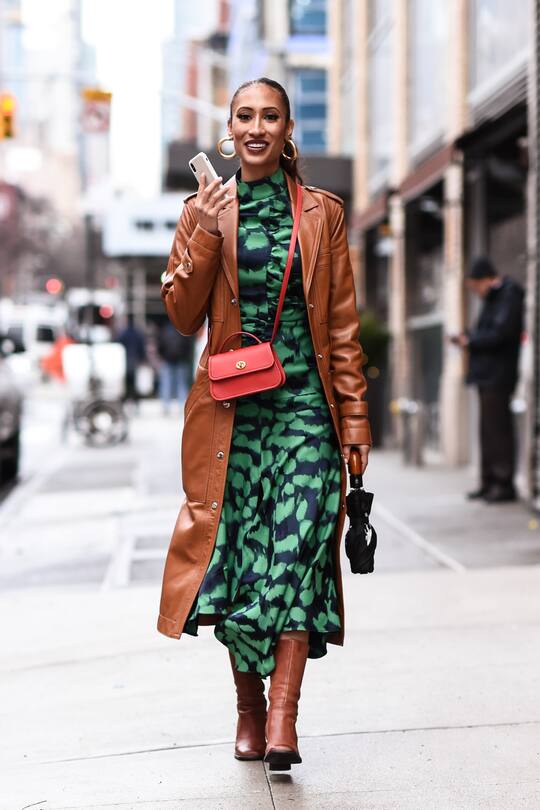 NEW YORK, NEW YORK - FEBRUARY 11: Elaine Welteroth is seen wearing a brown coat, green dress, red bag and brown boots outside the Coach 1941 show during New York Fashion Week: A/W20 on February 11, 2020 in New York City. (Photo by Daniel Zuchnik/Getty Images)