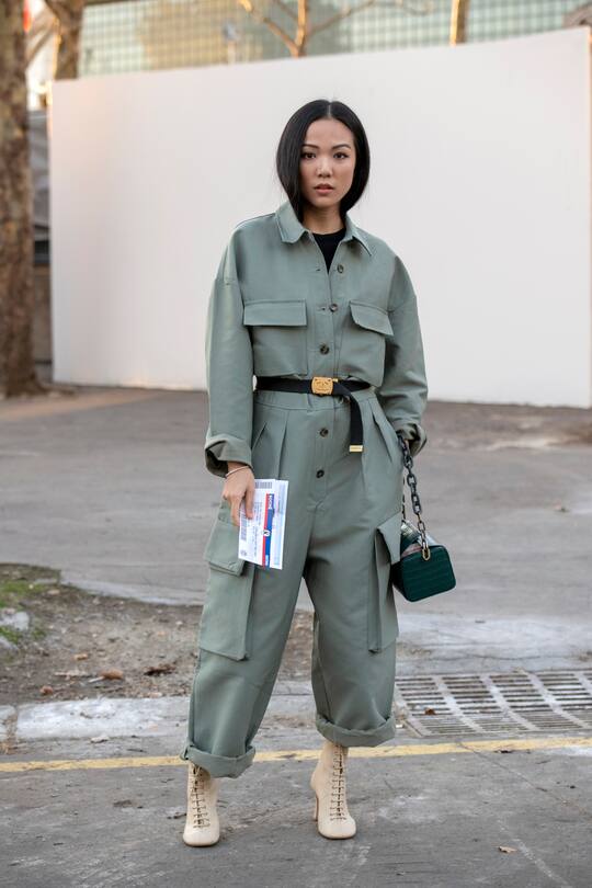 PARIS, FRANCE - FEBRUARY 26: Digital Influencer Yoyo Cao wears Celine boots, The Volon bag, Frankie Shop boiler suit and Chanel belt and a on February 26, 2019 in Paris, France. (Photo by Kirstin Sinclair/Getty Images)