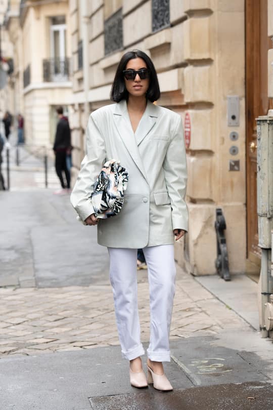 PARIS, FRANCE - MARCH 02: Tania Sarin Araradian wears a Drome jacket, and bag, Calvin Klein jeans, Illesteva sunglasses and Miista shoes on March 02, 2019 in Paris, France. (Photo by Kirstin Sinclair/Getty Images)