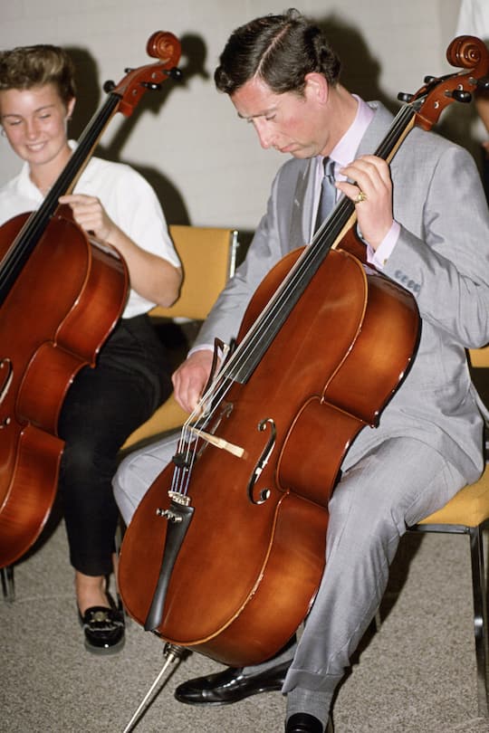 MELBOURNE, AUSTRALIA - JANUARY 28: Prince Charles Playing The Cello During A Visit To A Music School In Melbourne, Australia (Photo by Tim Graham Photo Library via Getty Images)