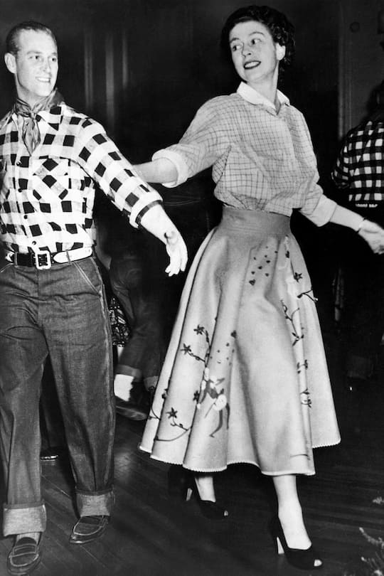 Queen Elizabeth II, Princess Elizabeth and the Duke of Edinburgh square dancing at a cowboy dress party during the royal tour of Canada (Photo by NCJ Archive/Mirrorpix/Mirrorpix via Getty Images)