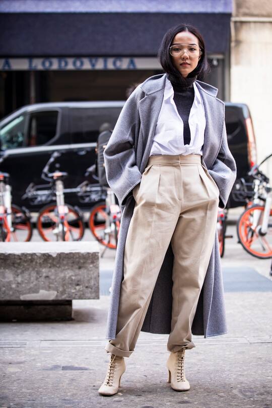 MILAN, ITALY - FEBRUARY 21: Yoyo Cao, wearing beige high waisted pants and grey coat, is seen outside Max Mara on Day 2 Milan Fashion Week Autumn/Winter 2019/20 on February 21, 2019 in Milan, Italy. (Photo by Claudio Lavenia/Getty Images)