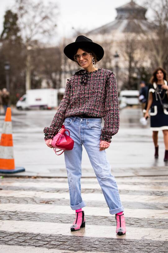 PARIS, FRANCE - FEBRUARY 27: Erika Boldrin (R) wears a turtleneck, a grey jacket with apparent white seams, a purple puff bag ; Blanca Miro (L) wears a black hat, a grey sleeveless vest, grey pants, a red puff bag, outside Maison Margiela, during Paris Fashion Week Womenswear Fall/Winter 2019/2020, on February 27, 2019 in Paris, France. (Photo by Edward Berthelot/Getty Images)