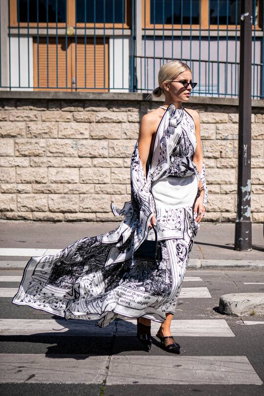 PARIS, FRANCE - JUNE 23: Caroline Daur, wearing a long black and white printed dress, black bag and black heels, is seen outside Lanvin fashion show on Day 6 during the Paris Fashion Week Spring/Summer 202> on June 23, 2019 in Paris, France. (Photo by Claudio Lavenia/Getty Images)