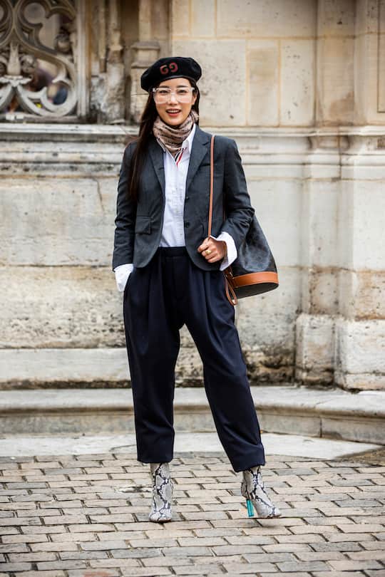 PARIS, FRANCE - SEPTEMBER 29: Ki Eunse, wearing a grey blazer, blue pants, snake print boots, Gucci hat and brown bag, is seen outside the Thom Browne show during Paris Fashion Week - Womenswear Spring Summer 2020 on September 29, 2019 in Paris, France. (Photo by Claudio Lavenia/Getty Images)