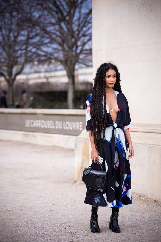 PARIS, FRANCE - JANUARY 15: Sharon Alexie, wearing a long printed dress, black bag and black boots, is seen outside the Off-White show during the Paris Fashion Week - Menswear F/W 2020-2021 on January 15, 2020 in Paris, France. (Photo by Claudio Lavenia/Getty Images)