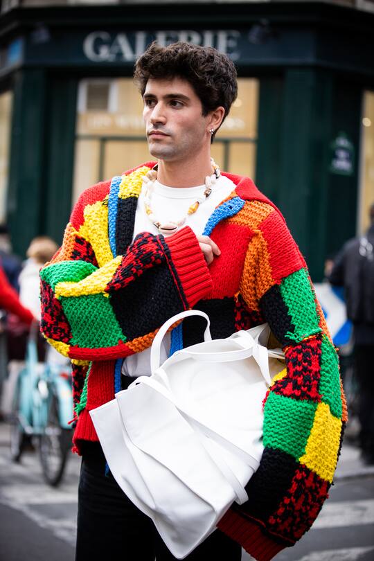 PARIS, FRANCE - JANUARY 15: Marc Forne, wearing a white t-shirt, colorful cardigan, seashell necklace and white maxi bag, is seen outside the JW Anderson show during the Paris Fashion Week - Menswear F/W 2020-2021 on January 15, 2020 in Paris, France. (Photo by Claudio Lavenia/Getty Images)