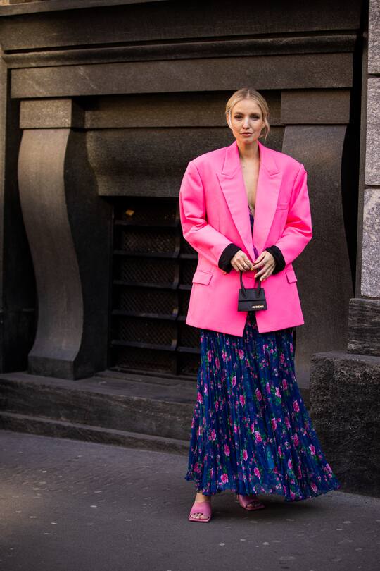 MILAN, ITALY - FEBRUARY 22: Leonie Hanne, wearing a blue floral print maxi dress, pink blazer, pink sandals and black Jacquemus bag, is seen outside Philosophy di Lorenzo Serafini show, during Milan Fashion Week Fall/Winter 2020-2021 on February 22, 2020 in Milan, Italy. (Photo by Claudio Lavenia/Getty Images)