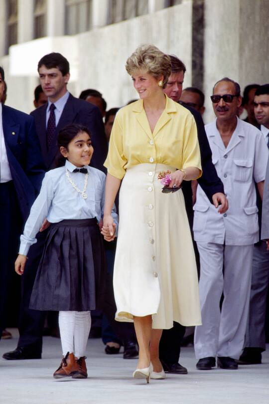 CAIRO, EGYPT - MAY 12: Princess Diana Walking With 10 Year Old Heba Salah Whom She Meet During A Visit To Cairo, Egypt (Photo by Tim Graham/Getty Images)