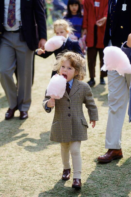 WINDSOR, UNITED KINGDOM - MAY 14: Princess Eugenie Eating Candyfloss During A Visit To The Royal Windsor Horse Show (Photo by Tim Graham Photo Library via Getty Images)