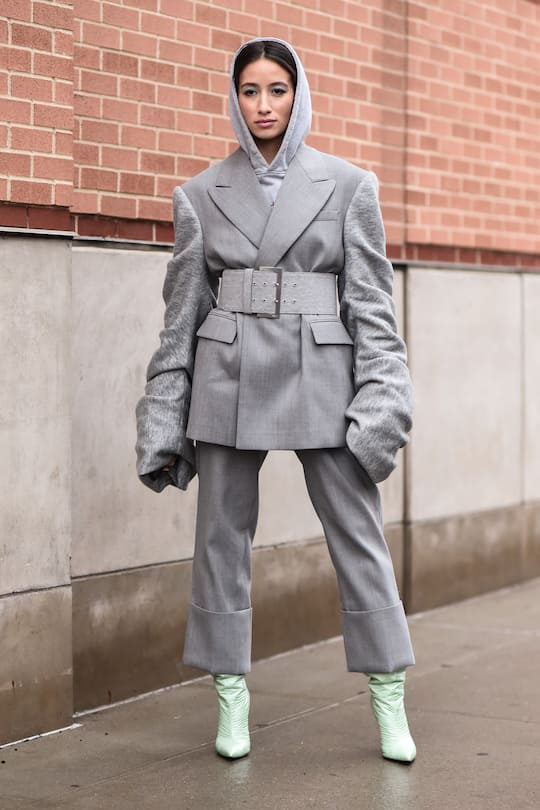 NEW YORK, NEW YORK - FEBRUARY 11: Alexandra Guerain is seen wearing an all gray outfit with bright green boots outside the Coach 1941 show during New York Fashion Week: A/W20 on February 11, 2020 in New York City. (Photo by Daniel Zuchnik/Getty Images)