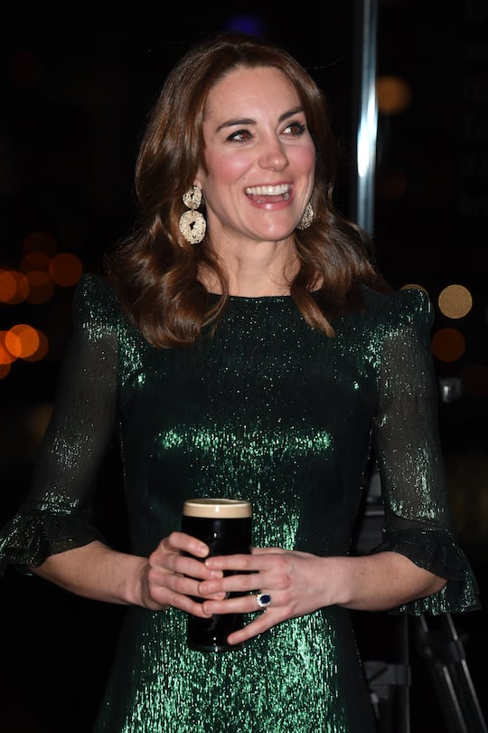 DUBLIN, IRELAND - MARCH 03: Catherine, Duchess of Cambridge drinks a pint of Guinness during a reception with Prince William, Duke of Cambridge, hosted by the British Ambassador to Ireland Robin Barnett, at the Guinness Storehouseâs Gravity Bar during day one of their visit to Ireland on March 03, 2020 in Dublin, Ireland. (Photo by James Whatling - WPA Pool/Getty Images)