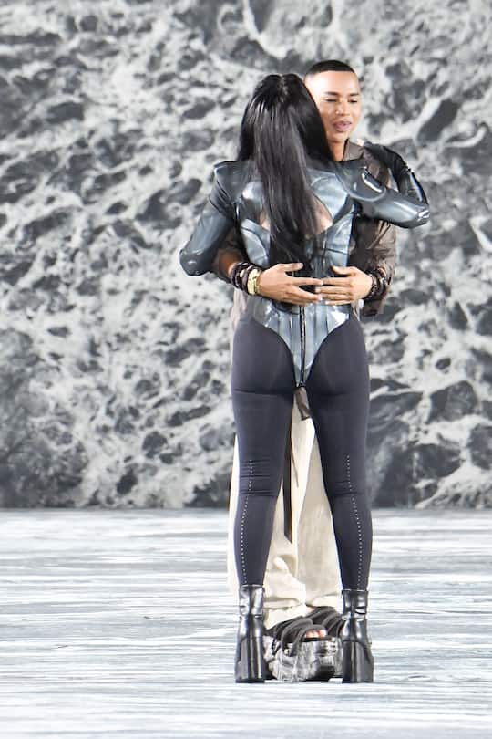 PARIS, FRANCE - SEPTEMBER 28: Performer Cher and Fashion designer Olivier Rousteing during the Balmain Ready to Wear Spring/Summer 2023 fashion show as part of the Paris Fashion Week on September 28, 2022 in Paris, France. (Photo by Victor VIRGILE/Gamma-Rapho via Getty Images)