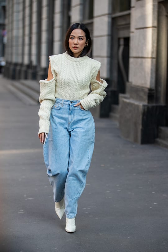 MILAN, ITALY - FEBRUARY 22: Yoyo Cao is seen wearing denim wide leg jeans, ripped jumper outside Philosophy during Milan Fashion Week Fall/Winter 2020-2021 on February 22, 2020 in Milan, Italy. (Photo by Christian Vierig/Getty Images)