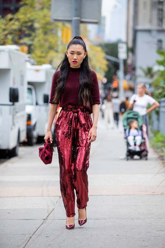 NEW YORK, NEW YORK - SEPTEMBER 10: Jaime Xie is seen wearing red pants, bordeaux knit outside Sally LaPointe during New York Fashion Week September 2019 on September 10, 2019 in New York City. (Photo by Christian Vierig/Getty Images)