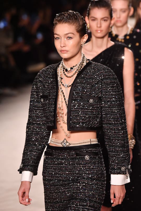 PARIS, FRANCE - DECEMBER 04: Gigi Hadid walks the runway during the Chanel Metiers d'art 2019-2020 show at Le Grand Palais on December 04, 2019 in Paris, France. (Photo by Stephane Cardinale - Corbis/Corbis via Getty Images)