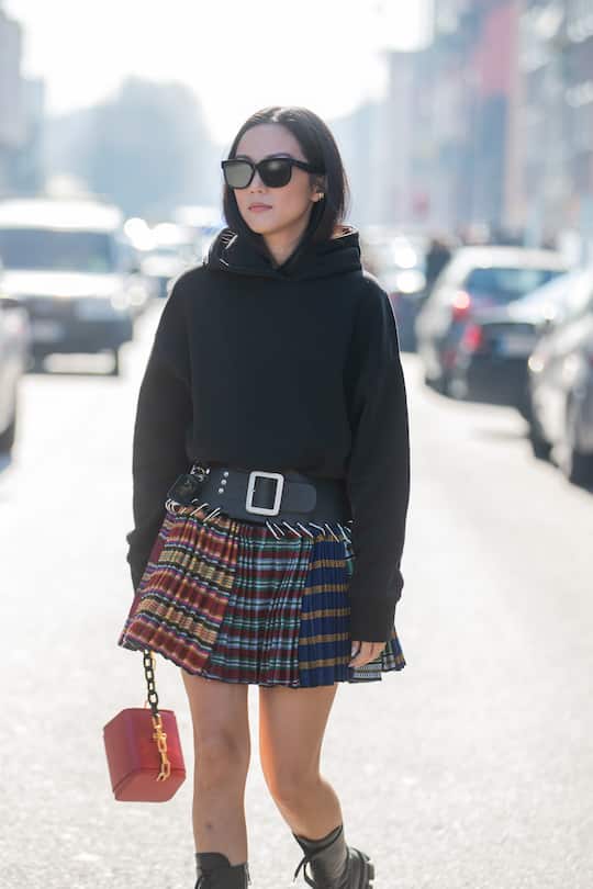 MILAN, ITALY - FEBRUARY 22: Yoyo Cao is seen wearing black hoody, mini skirt with belt outside MSGM during Milan Fashion Week Fall/Winter 2020-2021 on February 22, 2020 in Milan, Italy. (Photo by Christian Vierig/Getty Images)