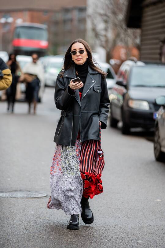 COPENHAGEN, DENMARK - JANUARY 30: A guest is seen wearing black leather jacket, skirt with mixed pattern outside By Malene Birger during Copenhagen Fashion Week Autumn/Winter 2020 Day 3 on January 30, 2020 in Copenhagen, Denmark. (Photo by Christian Vierig/Getty Images)