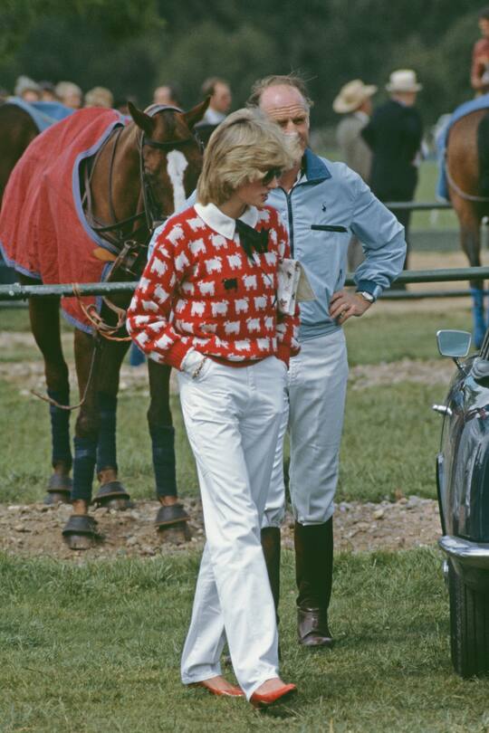 Diana, Princess of Wales (1961 - 1997) with Major Ronald Ferguson (1931 - 2003) at a polo match at Smith's Lawn, Guards Polo Club, Windsor, June 1983. Diana is wearing a Muir and Osborne 'black sheep' sweater. (Photo by Princess Diana Archive/Getty Images)