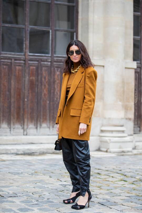 PARIS, FRANCE - SEPTEMBER 29: Deborah Reyner Sebag seen wearing orange brown blazer and turtleneck, black pants outside Thom Browne during Paris Fashion Week Womenswear Spring Summer 2020 on September 29, 2019 in Paris, France. (Photo by Christian Vierig/Getty Images)