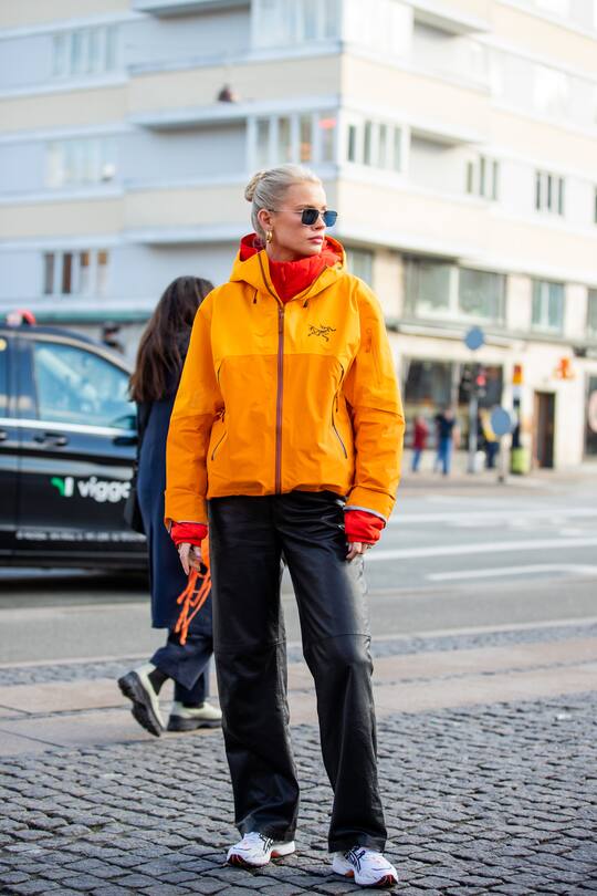 COPENHAGEN, DENMARK - FEBRUARY 02: Andrea Steen seen wearing orange windbreaker jacket outside A. Roege Hove during Copenhagen Fashion Week Autumn/Winter 2022 on February 02, 2022 in Copenhagen, Denmark. (Photo by Christian Vierig/Getty Images)
