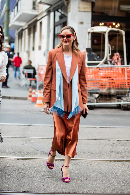 MILAN, ITALY - SEPTEMBER 19: Olivia Palermo is seen wearing rusty brown silk skirt, turquois scarf, blazer, purple heels, white shirt outside the Max Mara show during Milan Fashion Week Spring/Summer 2020 on September 19, 2019 in Milan, Italy. (Photo by Christian Vierig/Getty Images)