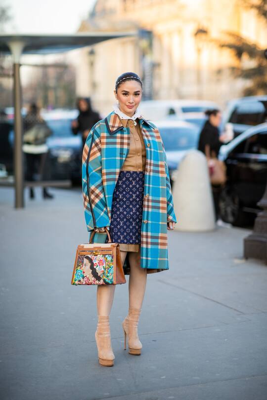 PARIS, FRANCE - JANUARY 21: A guest is seen wearing Louis Vuitton skirt, checkered coat outside Alexandre Vauthier during Paris Fashion Week - Haute Couture Spring/Summer 2020 on January 21, 2020 in Paris, France. (Photo by Christian Vierig/Getty Images )