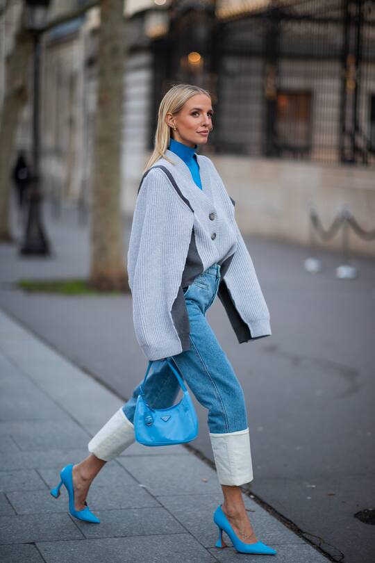 PARIS, FRANCE - JANUARY 22: Leonie Hanne seen wearing cuffed denim jeans, cardigan, blue turtleneck, Prada bag and heels outside Zuhair Murad during Paris Fashion Week - Haute Couture Spring/Summer 2020 on January 22, 2020 in Paris, France. (Photo by Christian Vierig/Getty Images )