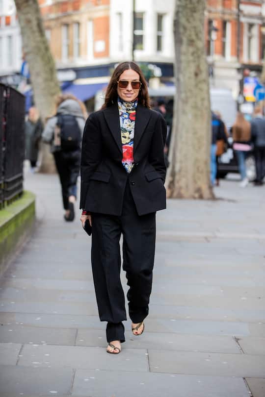 LONDON, ENGLAND - FEBRUARY 17: Erika Boldrin is seen wearing black waisted blazer, pants, Bottega sandals, turtleneck with floral print outside Erdem during London Fashion Week February 2020 on February 17, 2020 in London, England. (Photo by Christian Vierig/Getty Images)