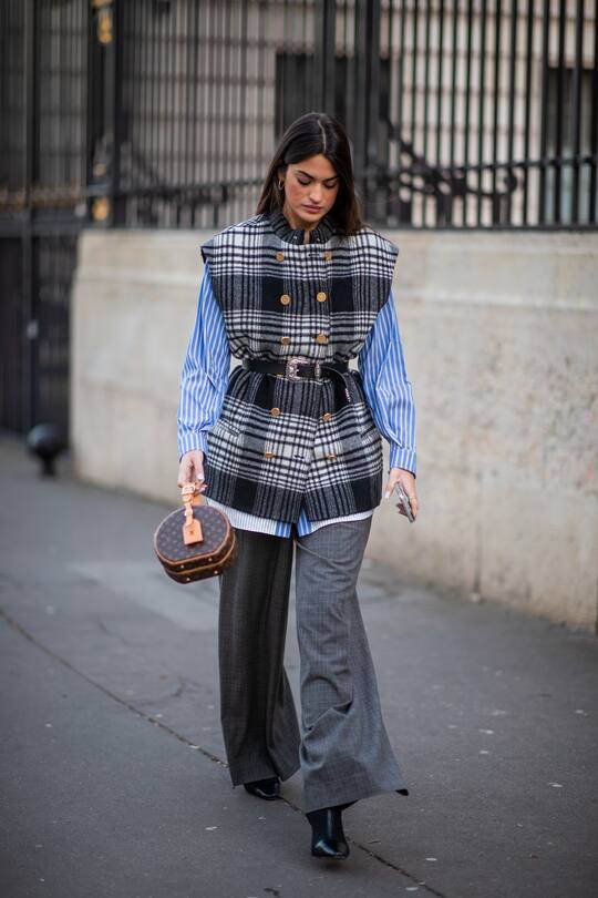 PARIS, FRANCE - JANUARY 22: Marta Lozano seen wearing checkered belted sleeveless jacket, stripped blouse, round Louis Vuitton bag, grey pants outside Zuhair Murad during Paris Fashion Week - Haute Couture Spring/Summer 2020 on January 22, 2020 in Paris, France. (Photo by Christian Vierig/Getty Images )