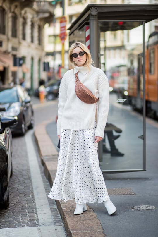 MILAN, ITALY - SEPTEMBER 23: Camille Charriere wearing white knit, white skirt is seen outside Philosophy during Milan Fashion Week Spring/Summer 2018 on September 23, 2017 in Milan, Italy. (Photo by Christian Vierig/Getty Images)
