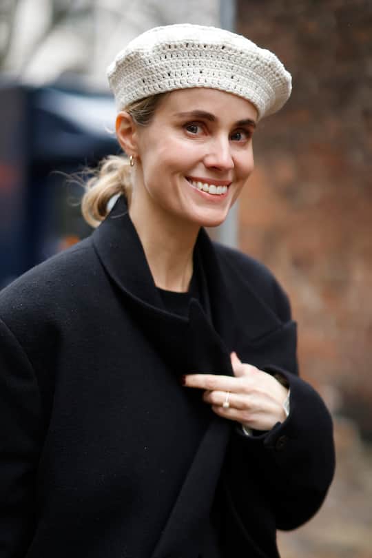 COPENHAGEN, DENMARK - FEBRUARY 01: Cecilie Thorsmark, CEO of CPHFW, wearing a long black coat and a cream-colored crochet beret, seen at the ISO.POETISM show by Tobias Birk Nielsen on February 1, 2022 in Copenhagen, Denmark. (Photo by Streetstyleshooters/Getty Images)