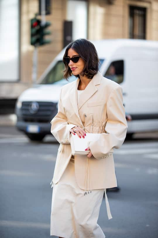 MILAN, ITALY - FEBRUARY 25: Bettina Looney seen wearing beige blazer, creme white dress, bag outside Sportmax fashion show during the Milan Fashion Week Fall/Winter 2022/2023 on February 25, 2022 in Milan, Italy. (Photo by Christian Vierig/Getty Images)