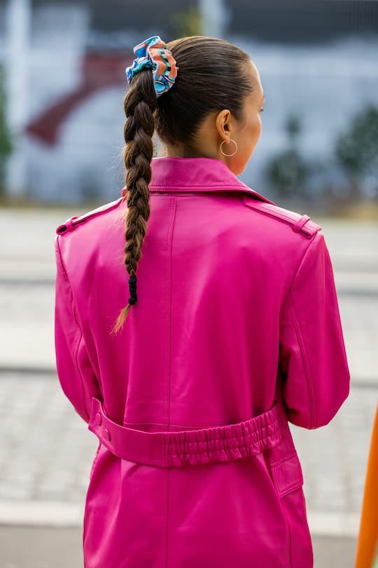 COPENHAGEN, DENMARK - AUGUST 09: A guest is seen with pigtail outside Remain during Copenhagen Fashion Week Spring/Summer 2023 on August 09, 2022 in Copenhagen, Denmark. (Photo by Christian Vierig/Getty Images)