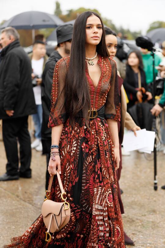PARIS, FRANCE - SEPTEMBER 24: Bruna Marquezine wearing red sheer embroidered dress with Dior leather belt on September 24, 2019 in Paris, France. (Photo by Hanna Lassen/Getty Images)