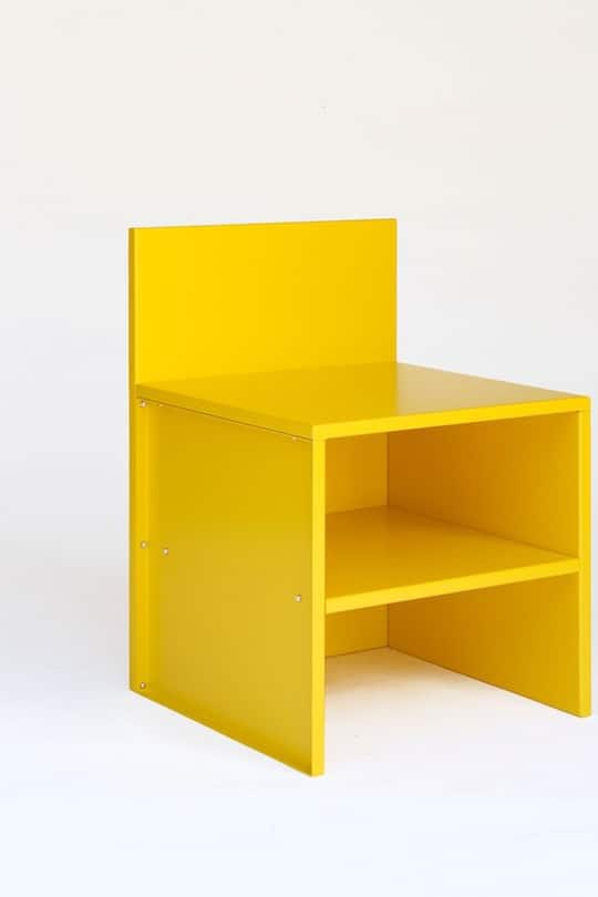 yellow designer chair on white background
