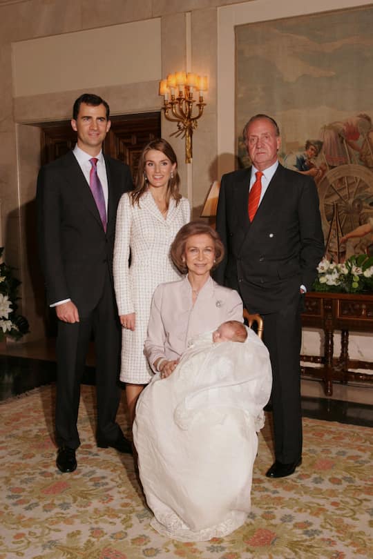 From left to right: Crown Prince Felipe, Princess Letizia Ortiz, King Juan Carlos and his wife Queen Sofia, holding grand-daughter Infanta Leonor following the baptism ceremony at the Zarzuela Palace. | Location: Madrid, Spain. (Photo by Pool/Corbis via Getty Images)
