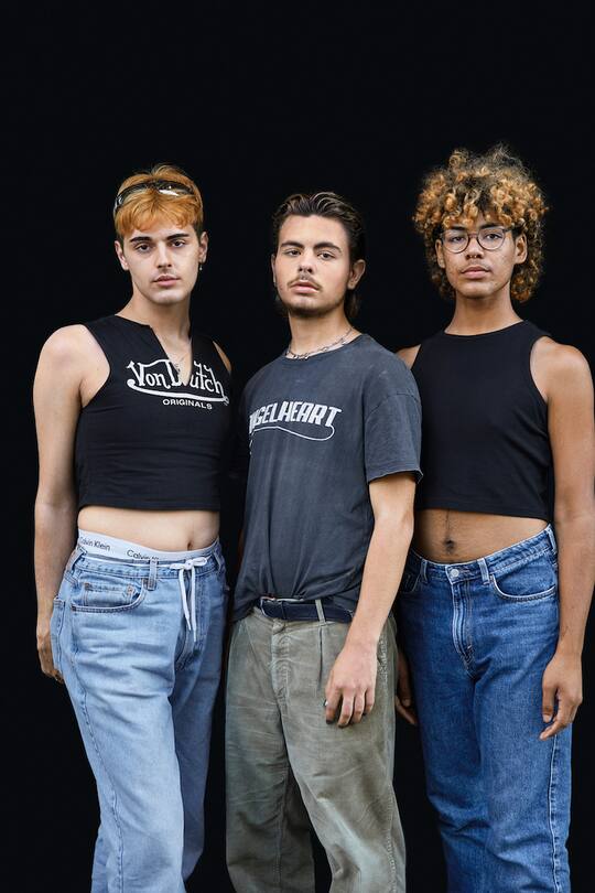 Three teenagers black background