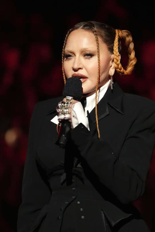 LOS ANGELES, CALIFORNIA - FEBRUARY 05: Madonna speaks onstage during the 65th GRAMMY Awards at Crypto.com Arena on February 05, 2023 in Los Angeles, California. (Photo by Kevin Mazur/Getty Images for The Recording Academy)
