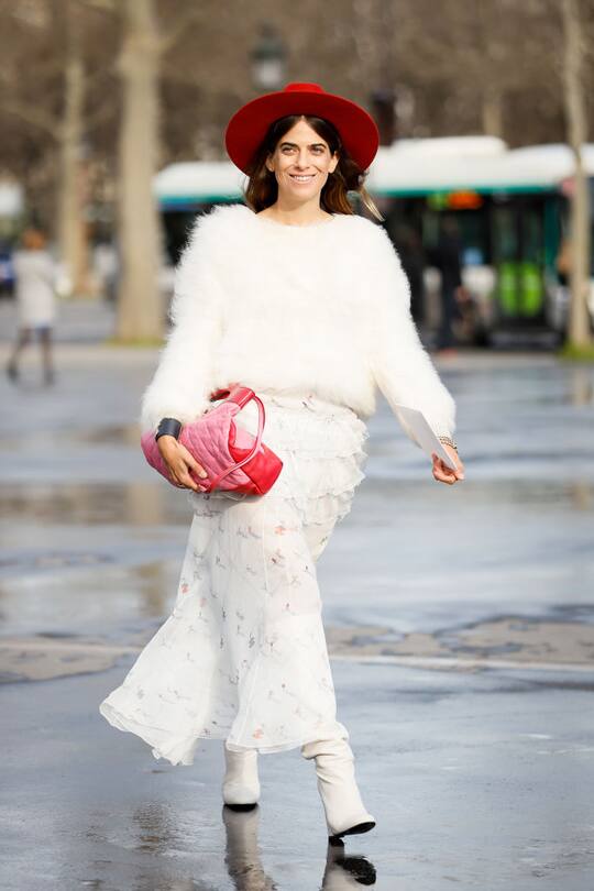 PARIS, FRANCE - MARCH 03: A guest wearing Chanel pink bag, red fedora, white fluffy jumper, white leather boots and maxi skirt outside the Chanel show during Paris Fashion Week Womenswear Fall/Winter 2020/2021 Day Nine on March 03, 2020 in Paris, France. (Photo by Hanna Lassen/Getty Images)