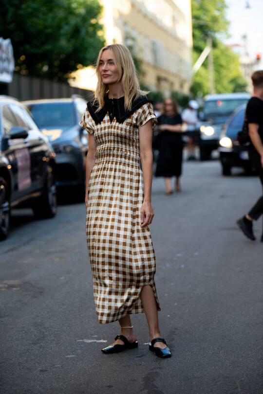 COPENHAGEN, DENMARK - AUGUST 10: Marie Hindkær outside Ganni wearing withe and brown checked dress during Copenhagen fashion week SS21 on August 10, 2020 in Copenhagen, Denmark. (Photo by Raimonda Kulikauskiene/Getty Images)