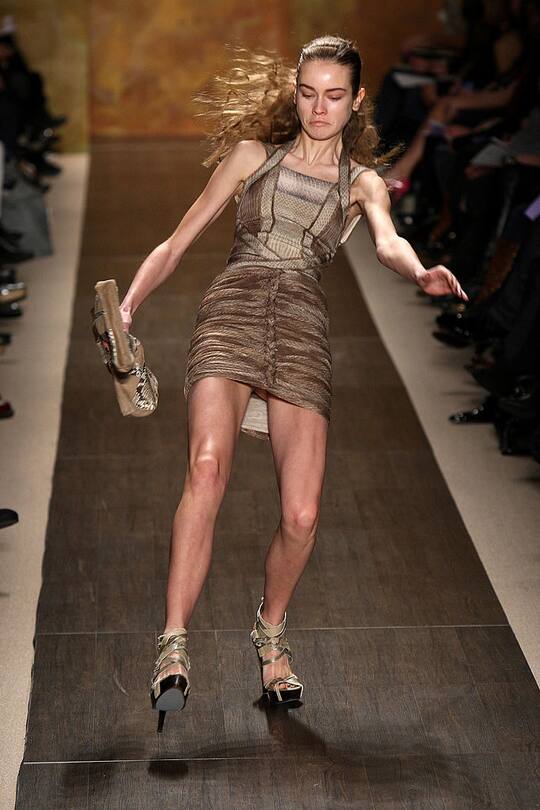 NEW YORK - FEBRUARY 15: A model falls as she walks the runway at the Herve Leger Fall 2009 fashion show during Mercedes-Benz Fashion Week in the Promenade at Bryant Park on February 15, 2009 in New York City. (Photo by Scott Gries/Getty Images for IMG)