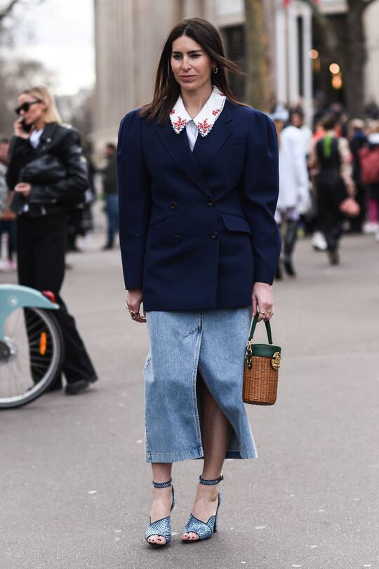 PARIS, FRANCE - MARCH 03: A guest is seen wearing a blue jacket, jean skirt and blue shoes and MIu Miu bag outside the Miu Miu show during Paris Fashion Week: AW20 on March 03, 2020 in Paris, France. (Photo by Daniel Zuchnik/Getty Images)
