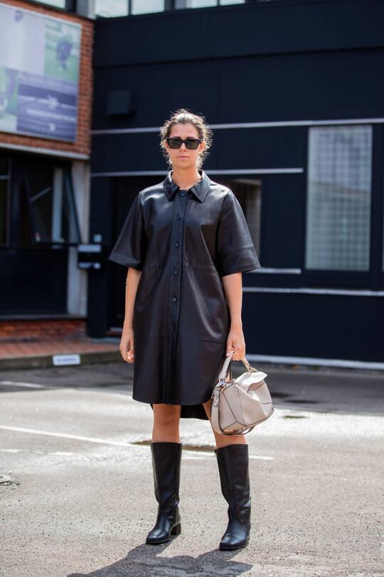 COPENHAGEN, DENMARK - AUGUST 08: Elisa Schenke is seen wearing black leather dress, Loewe bag, boots outside By Malene Birger during Copenhagen Fashion Week Spring/Summer 2020 on August 08, 2019 in Copenhagen, Denmark. (Photo by Christian Vierig/Getty Images)
