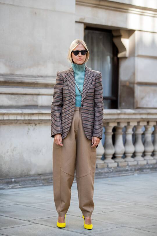 LONDON, ENGLAND - SEPTEMBER 15: Linda Tol wearing beige pants, checkered blazer seen outside Victoria Beckham during London Fashion Week September 2019 on September 15, 2019 in London, England. (Photo by Christian Vierig/Getty Images)