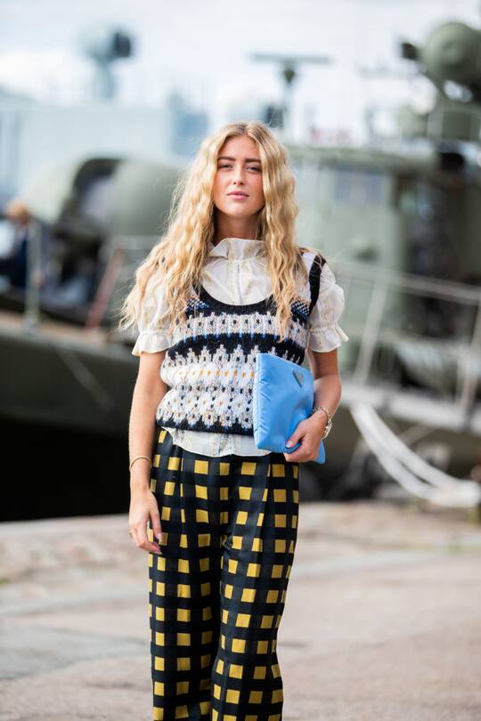 COPENHAGEN, DENMARK - AUGUST 08: Emili Sindlev is seen wearing yellow black plaid pants outside Stine Goya during Copenhagen Fashion Week Spring/Summer 2020 on August 08, 2019 in Copenhagen, Denmark. (Photo by Christian Vierig/Getty Images)